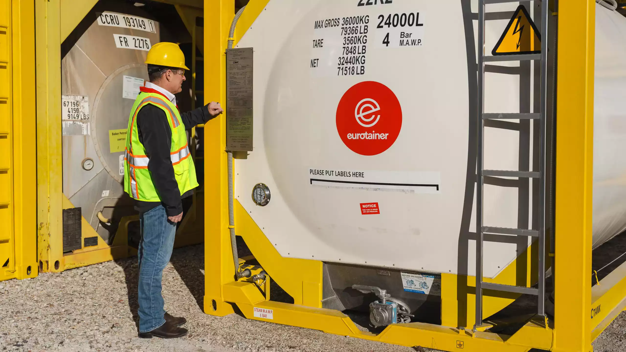 technician reading specification of tank container liquid eurotainer