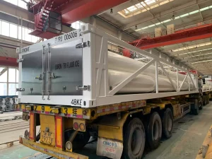MEGC Tank container on chassis under workshop - eurotainer