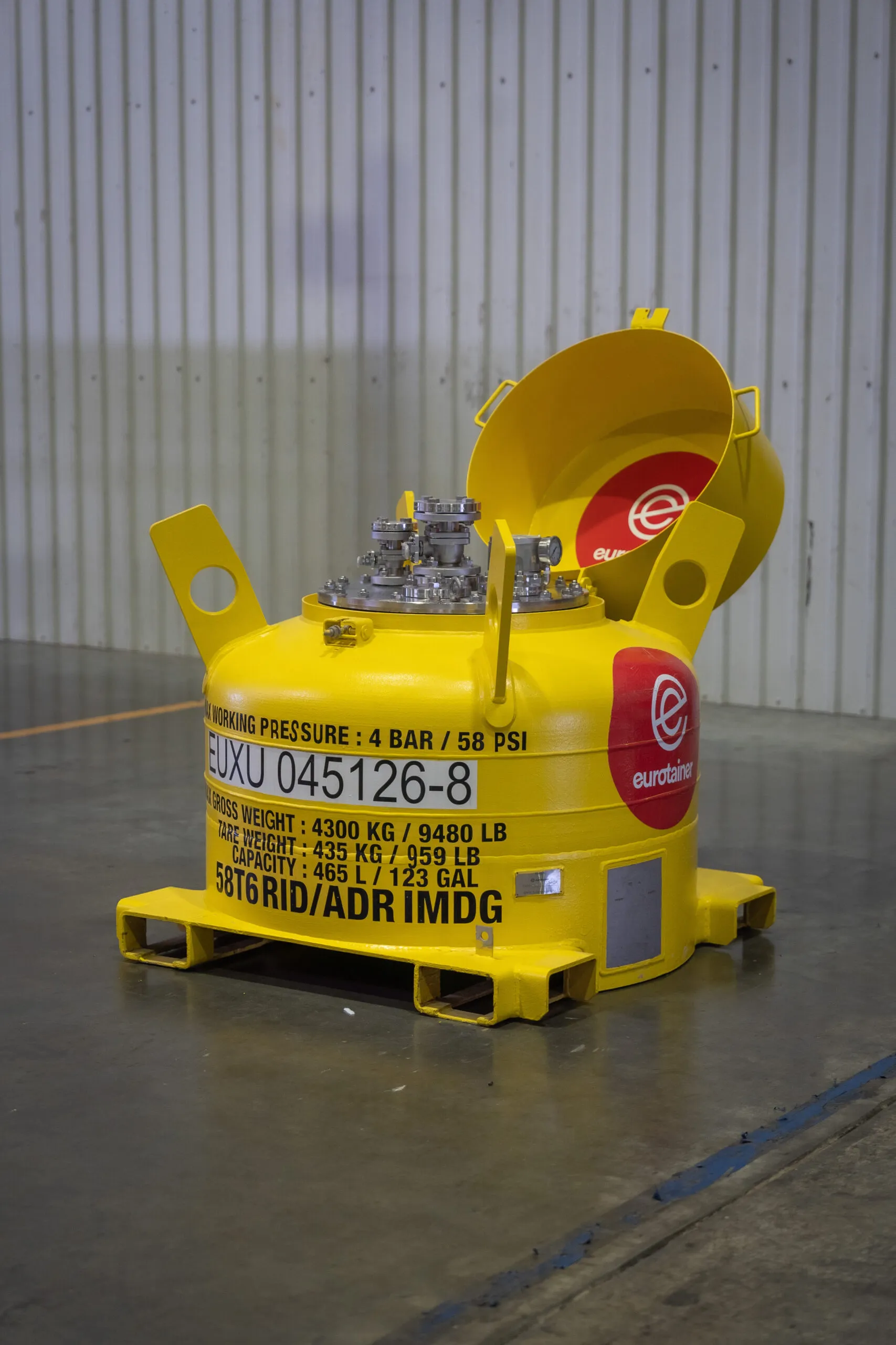 Small portable tank with valves on workshop - eurotainer