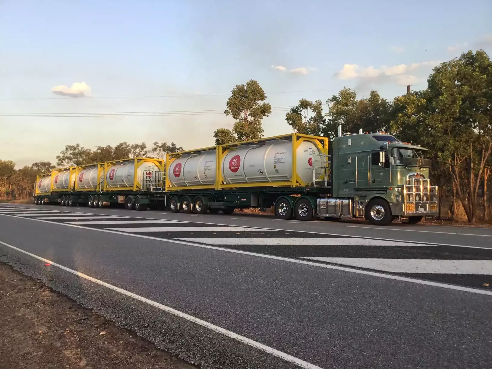 Tank container liquid with 6 containers on same truck australia road - eurotainer