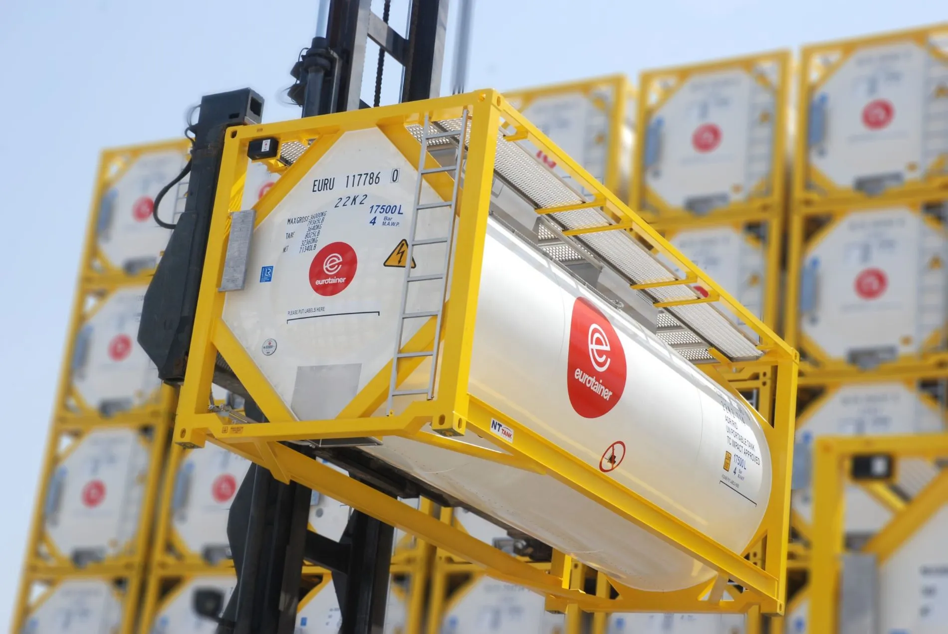 T14 tank container liquid on lift with fleet on depot - eurotainer