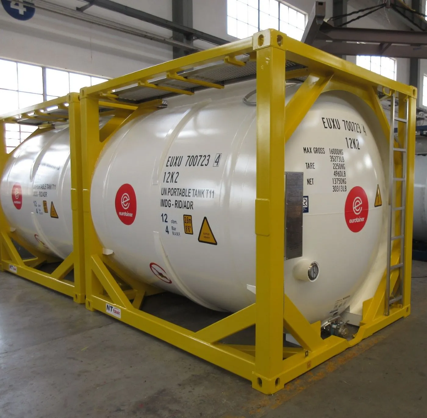 Ten foot tank container liquid T11 side view with valves on workshop - eurotainer