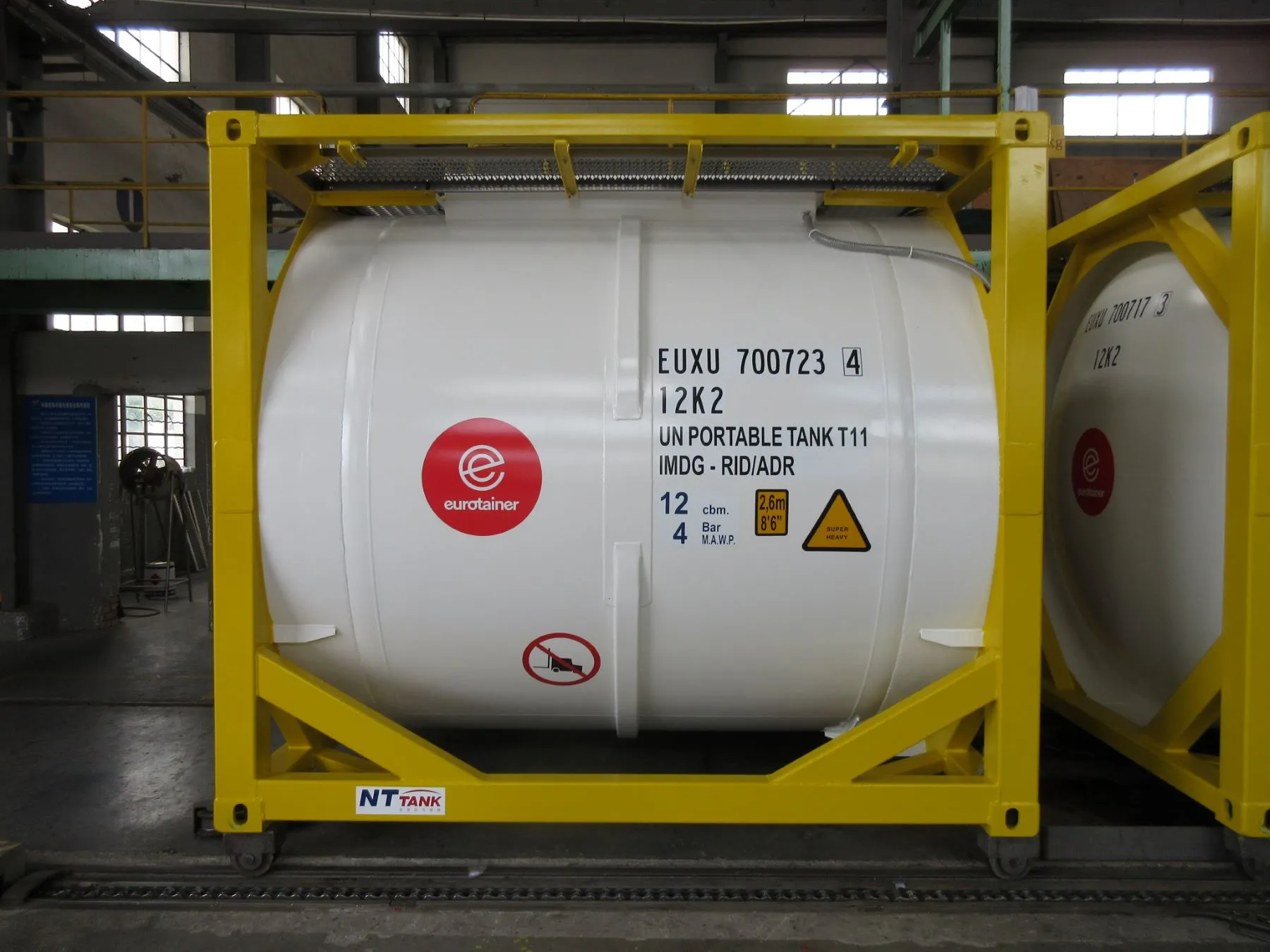 Ten foot tank container liquid side view on workshop - eurotainer
